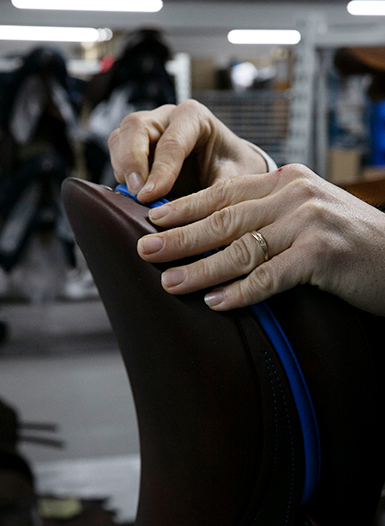 The leather riding saddle is inspected and oiled as soon as it is fully assembled.
