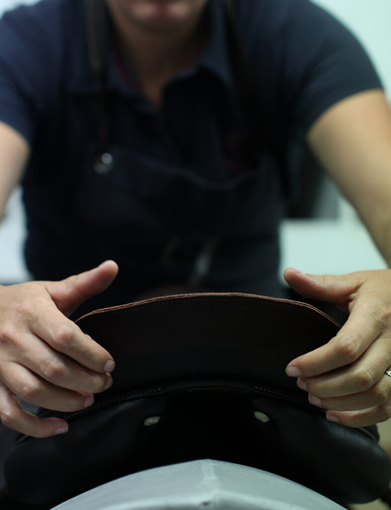 The leather riding saddle is inspected and oiled as soon as it is fully assembled.