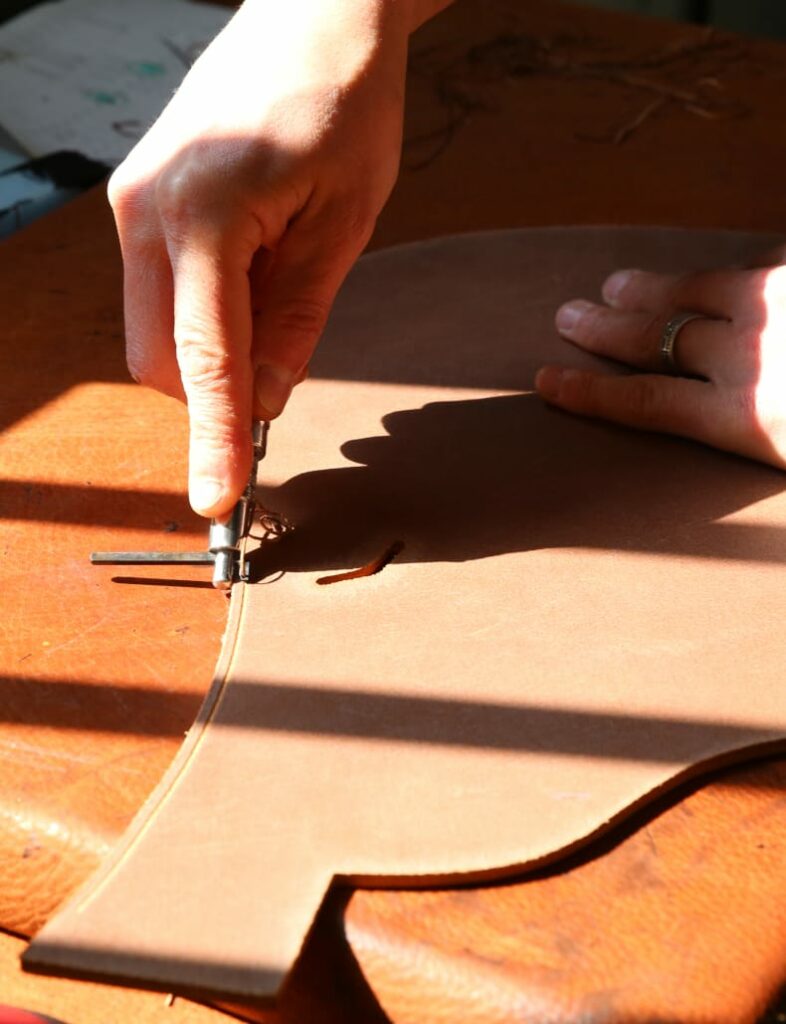 Preparing the customs saddle leather parts for horse and rider