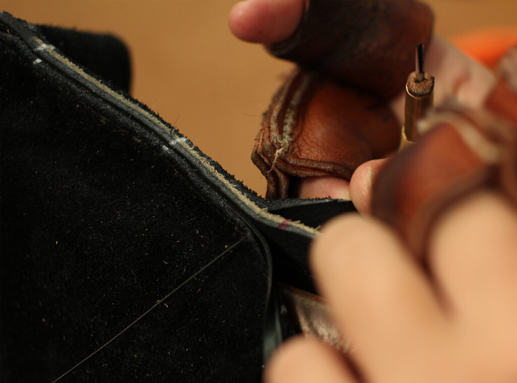 The seat of our leather custom saddle is attached to the skirts with hand-sewn seams.