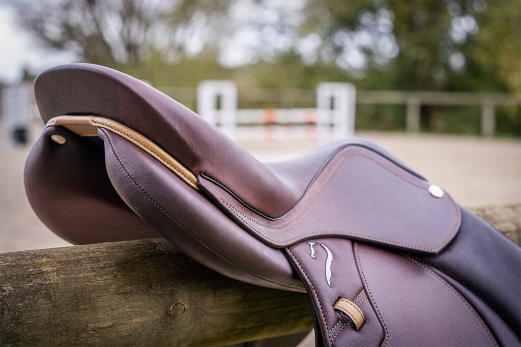 Its shape allows for more clearance along the horse's spine, promoting greater freedom of movement in the horse's back.